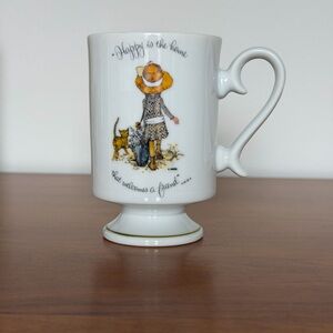 Holly Hobbie Porcelain Pedestal Mug -“Happy Is The Home That Welcomes A Friend “